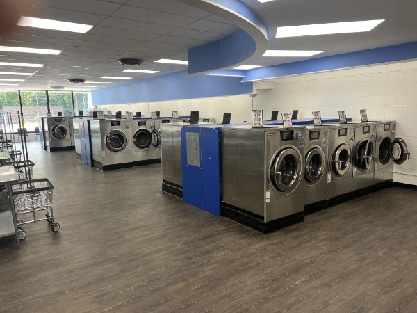 High-capacity commercial washer banks at Laskey's Laundry